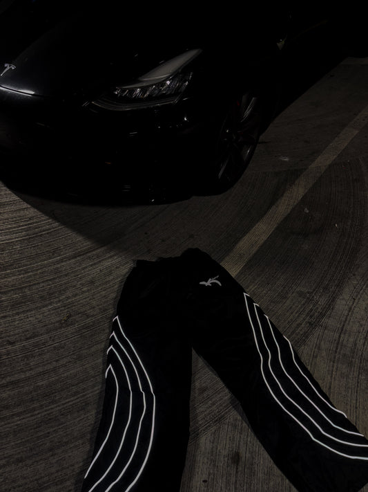 BLACK REFLECTIVE LOGO TEXT TRACK PANTS